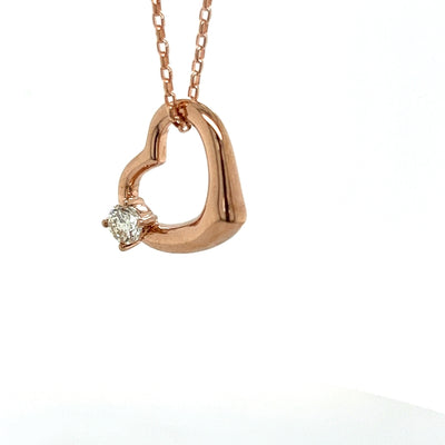 Floating Open Heart Pendant set with 1/2 carat Diamond.