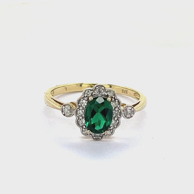 9ct Gold Created Emerald & Diamond Oval Cluster Ring.