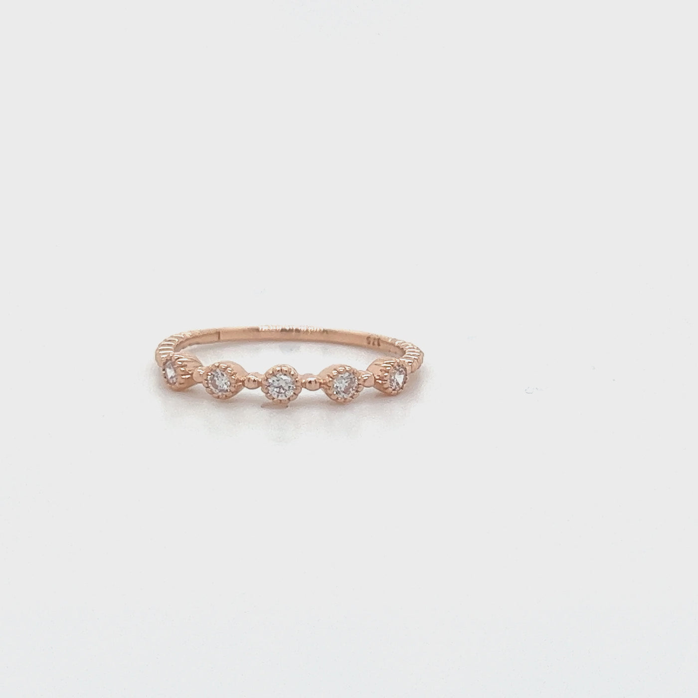9ct Rose Gold Band set with Cubic zirconias.