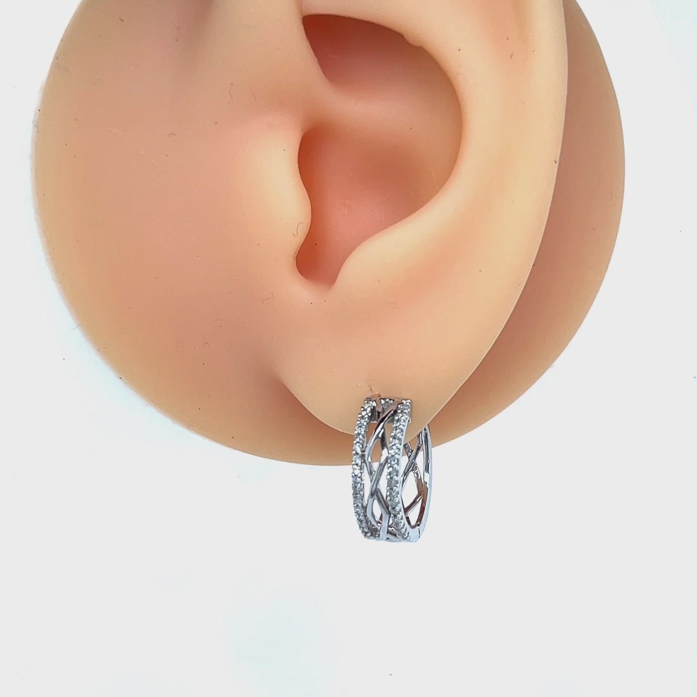 9ct White Gold Infinity Pattern Diamond Huggie Earrings.