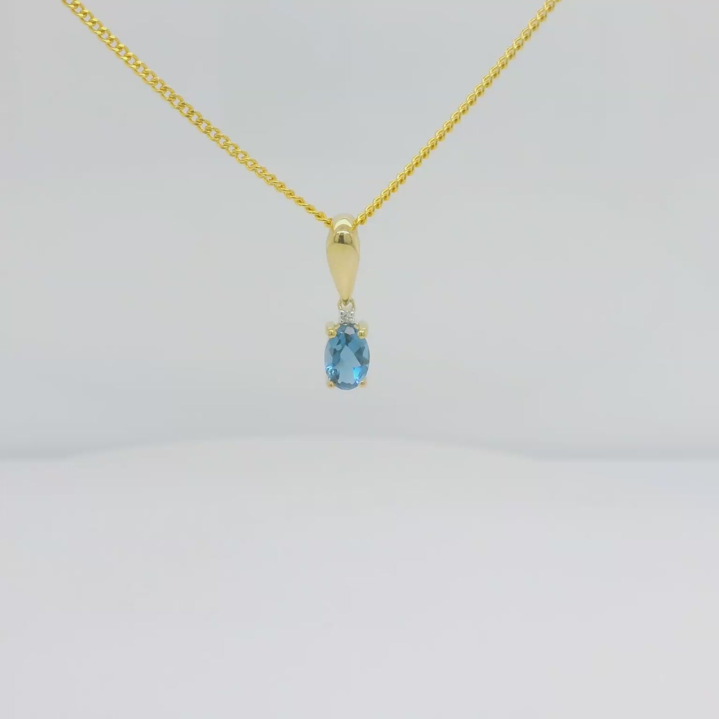 Oval London Blue Topaz & Diamond Pendant - Yellow Gold.