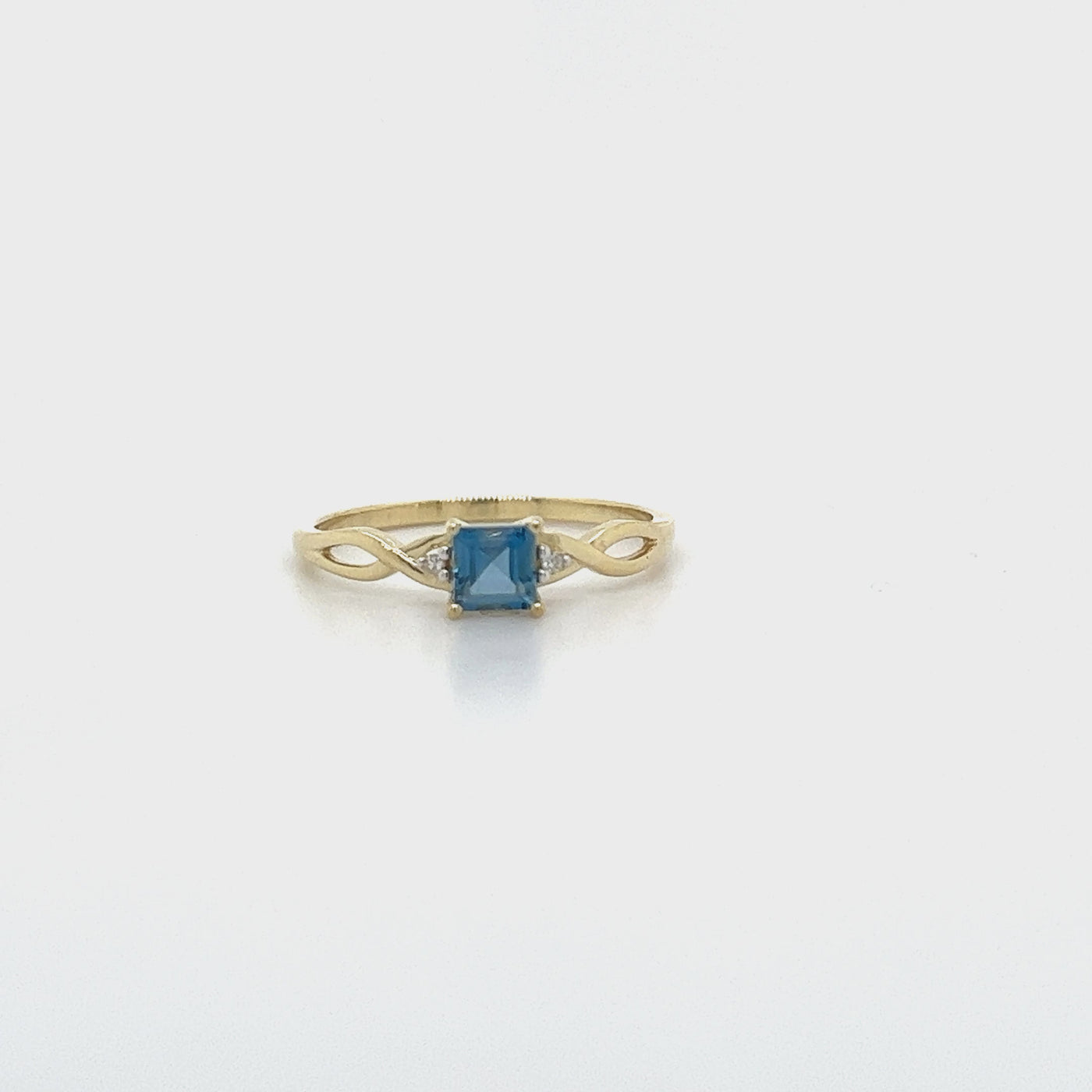9ct Gold London Blue Topaz & Diamond Dress Ring with Infinity Shoulders.
