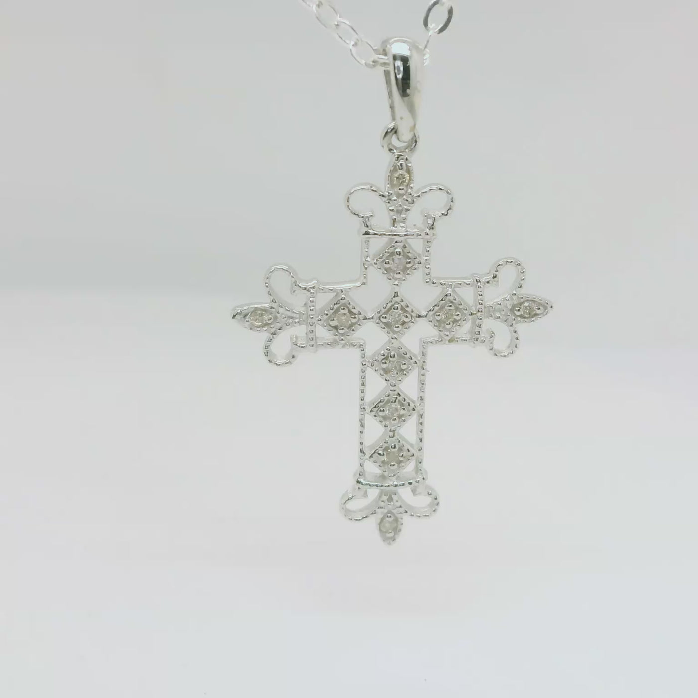 9ct White Gold Fancy Diamond Set Cross.