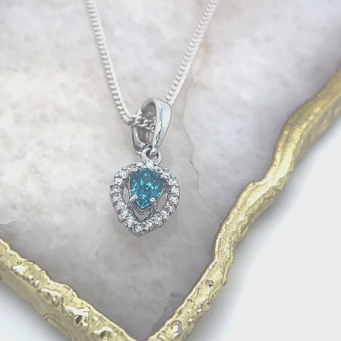 9ct White Gold Blue Zircon & Diamond pendant